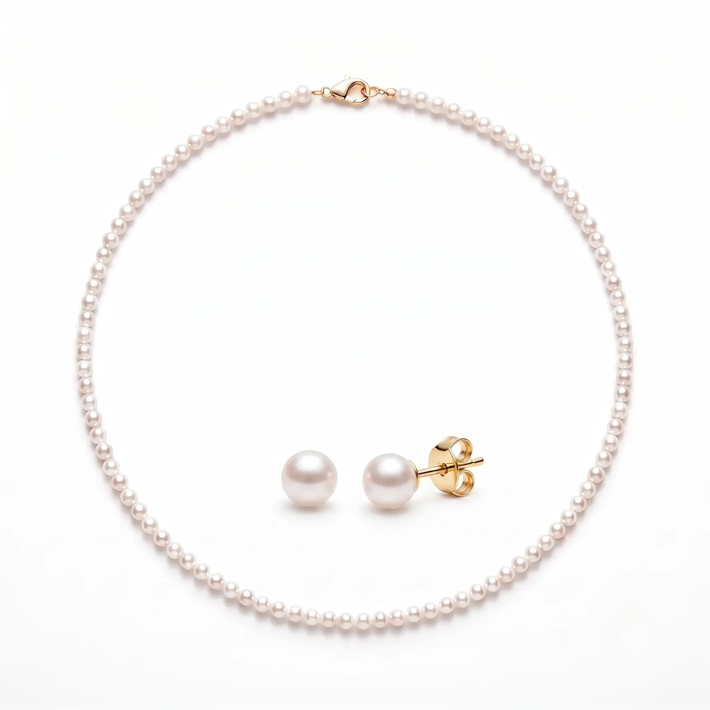 Solid gold freshwater pearl necklace and stud earrings set featuring hand-selected pearls with a classic minimalist design.
