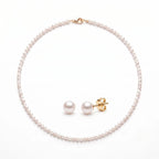 Solid gold freshwater pearl necklace and stud earrings set featuring hand-selected pearls with a classic minimalist design.