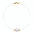 Studio shot of the floating AAA pearl and 18K solid gold bead pendant necklace on a clean white background.