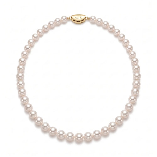 Wedding flatlay displaying the handcrafted 18K gold pearl bridal choker alongside elegant wedding invitations.