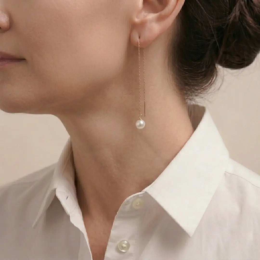 Model in white shirt wearing 18K Gold Pearl Threaders