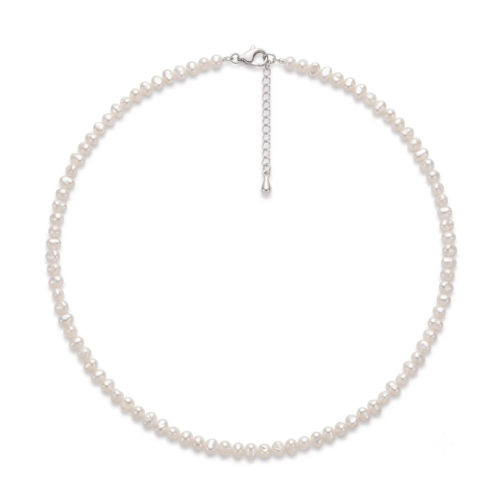 Mini freshwater seed pearl necklace featuring unique organic pearls with soft luster and a delicate minimalist design.