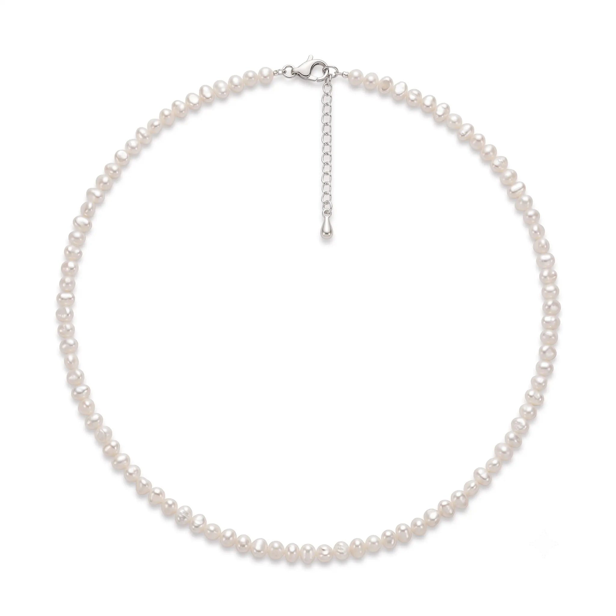 Mini freshwater seed pearl necklace featuring unique organic pearls with soft luster and a delicate minimalist design.