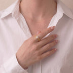 Front view of a model styling the sophisticated Akoya pearl ring with modern attire, highlighting its celestial harmony and everyday versatility.