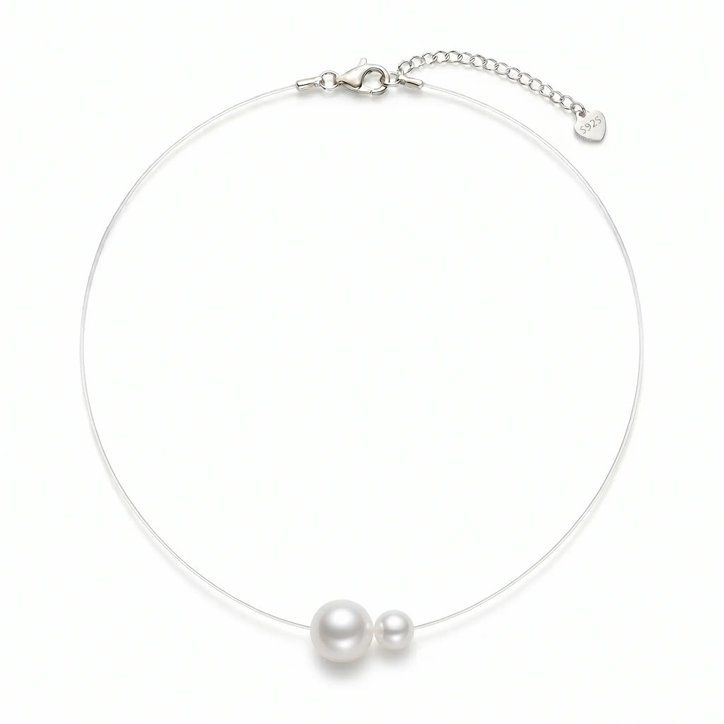 Minimalist floating illusion single pearl strand necklace with a tarnish-resistant clasp, front view studio shot.