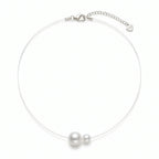 Minimalist floating illusion single pearl strand necklace with a tarnish-resistant clasp, front view studio shot.