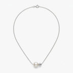 Studio shot of the asymmetrical 18K white gold plated sterling silver necklace on a clean white background.