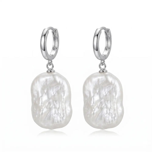 Geometric baroque pearl huggie hoop earrings featuring organic freshwater pearls and rhodium-plated 925 sterling silver rectangular hoops.