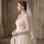 Woman wearing a woven pearl collar necklace, showcasing timeless heirloom-inspired elegance and vintage luxury.